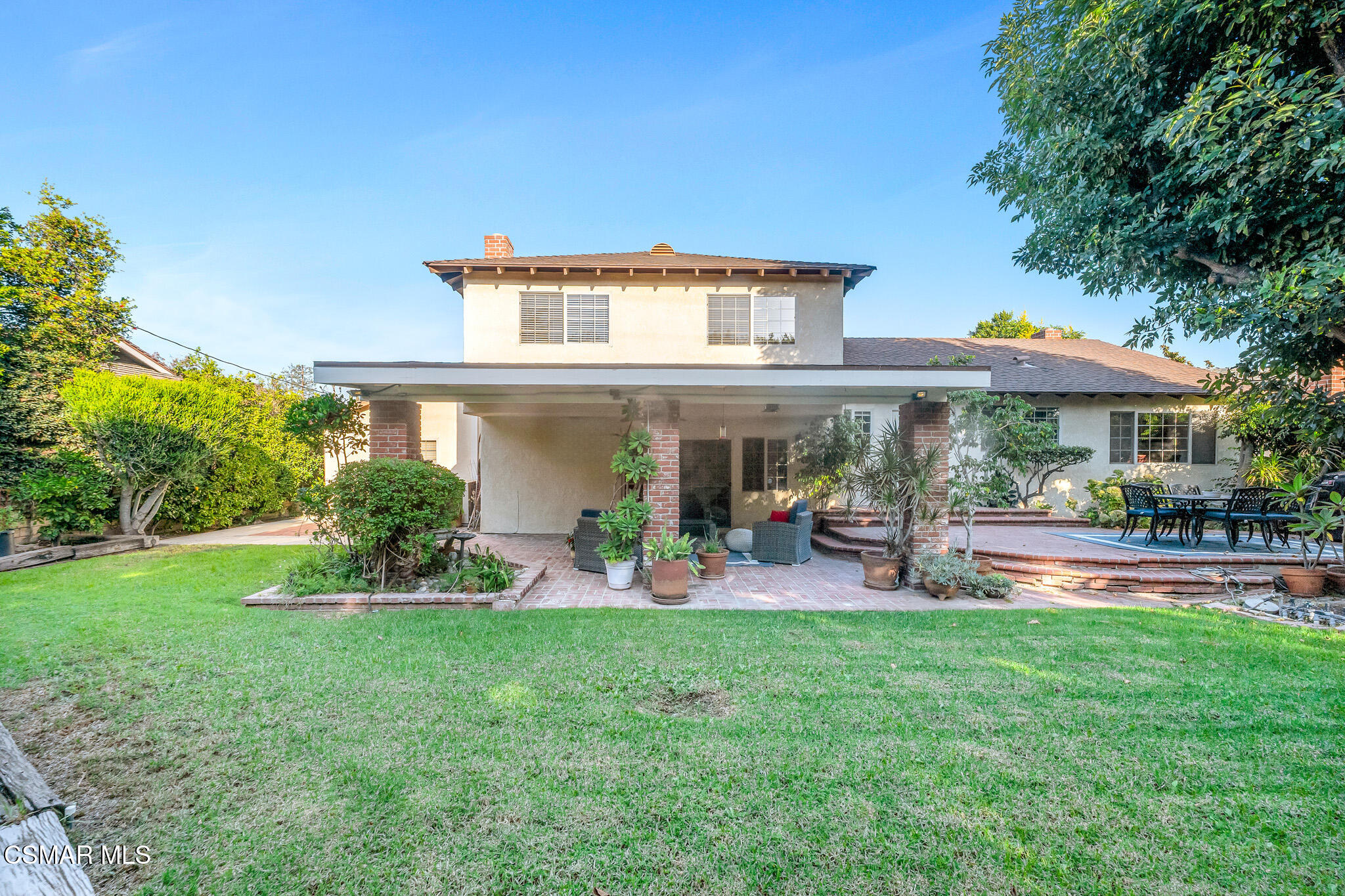 3037 Divernon Avenue Simi Valley, CA 93063 - Photo 41 of 44 a front view of a house with garden and sitting area