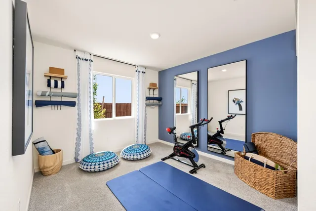 a living room with furniture and next to a window