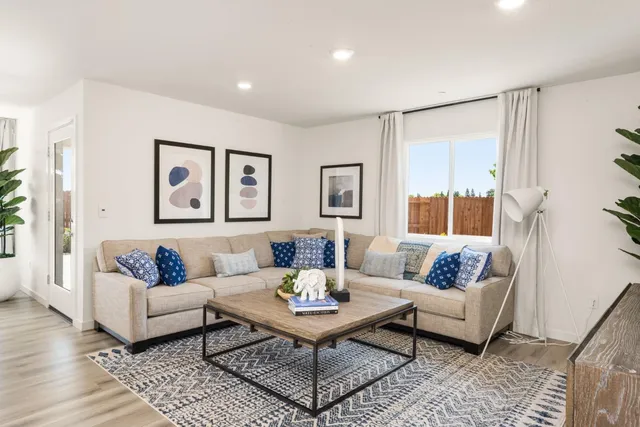 a living room with furniture and a table
