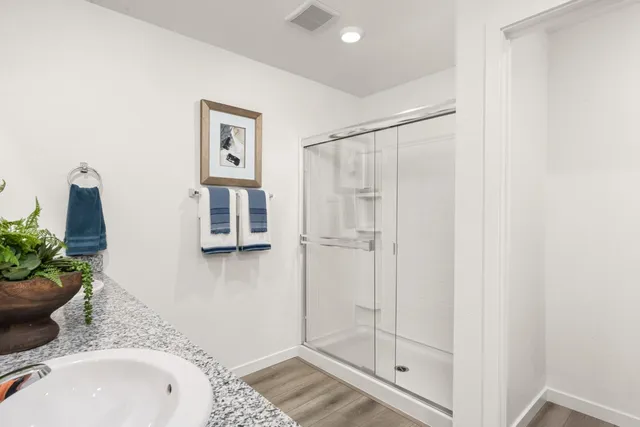 a bathroom with a sink toilet and shower