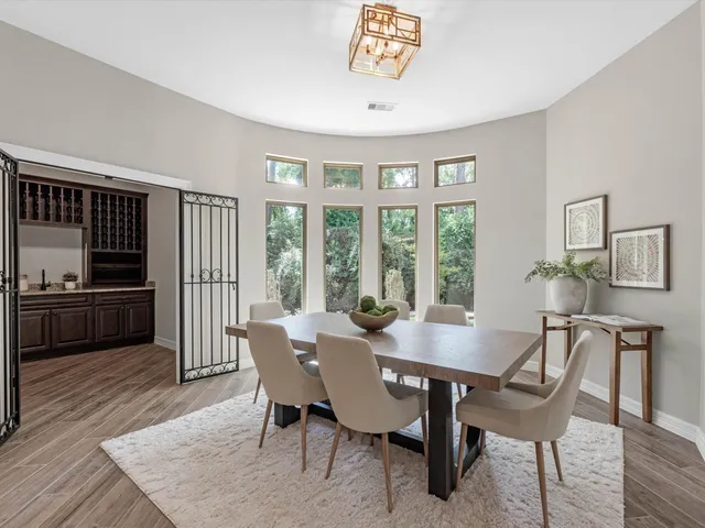 a view of a dining room with furniture window and wooden floor