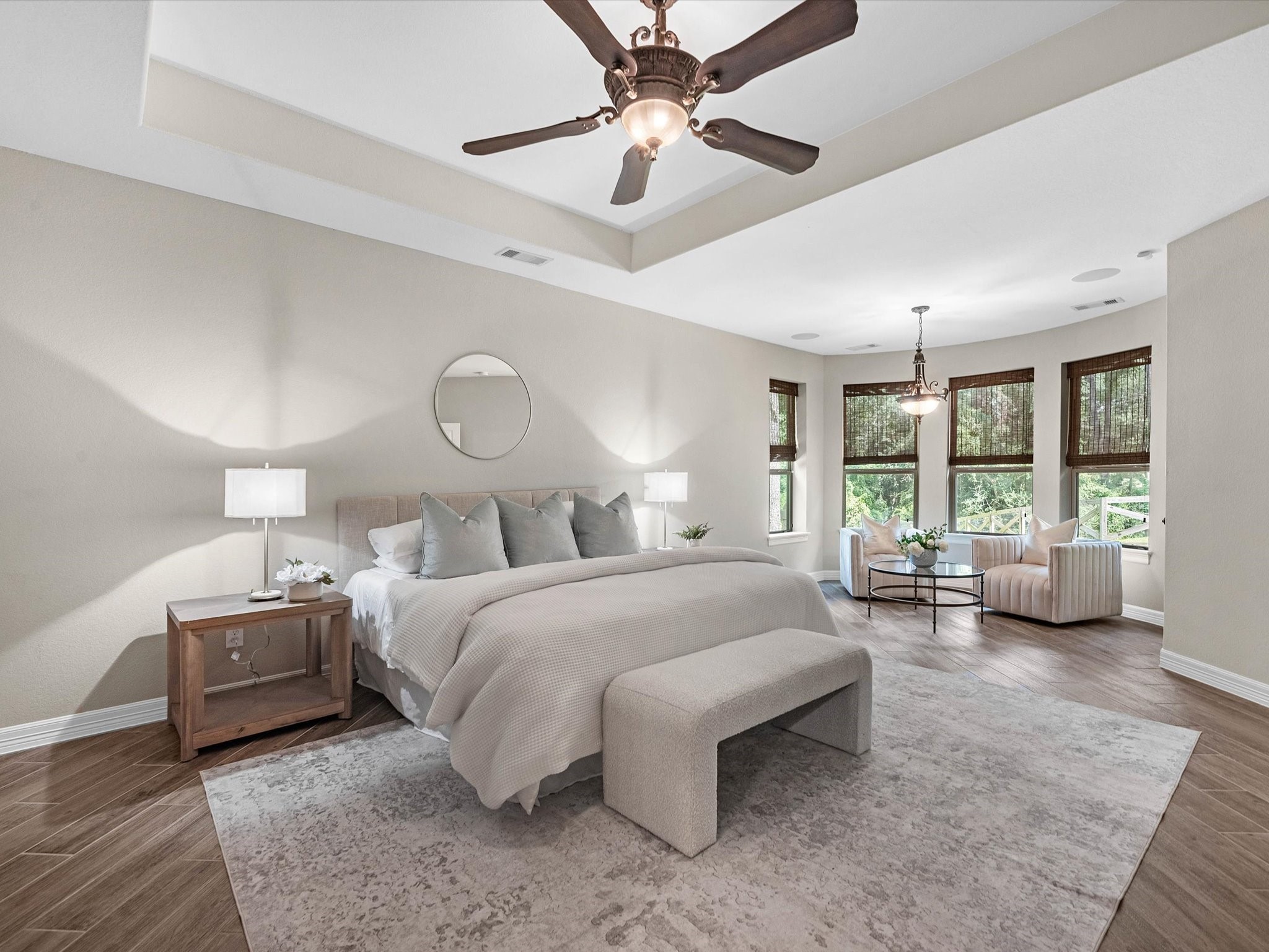 19332 Chateau Ridge Court Tomball, TX 77377 - Photo 20 of 50 a spacious bedroom with a bed a chandelier and large window