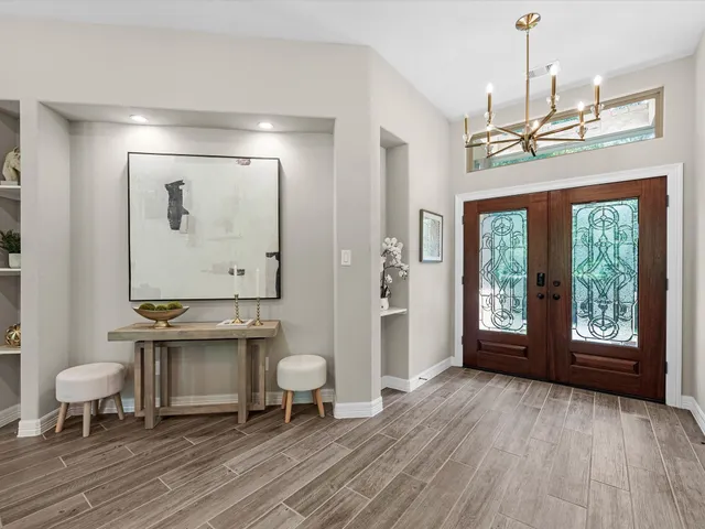 a view of a livingroom with furniture window and wooden floor