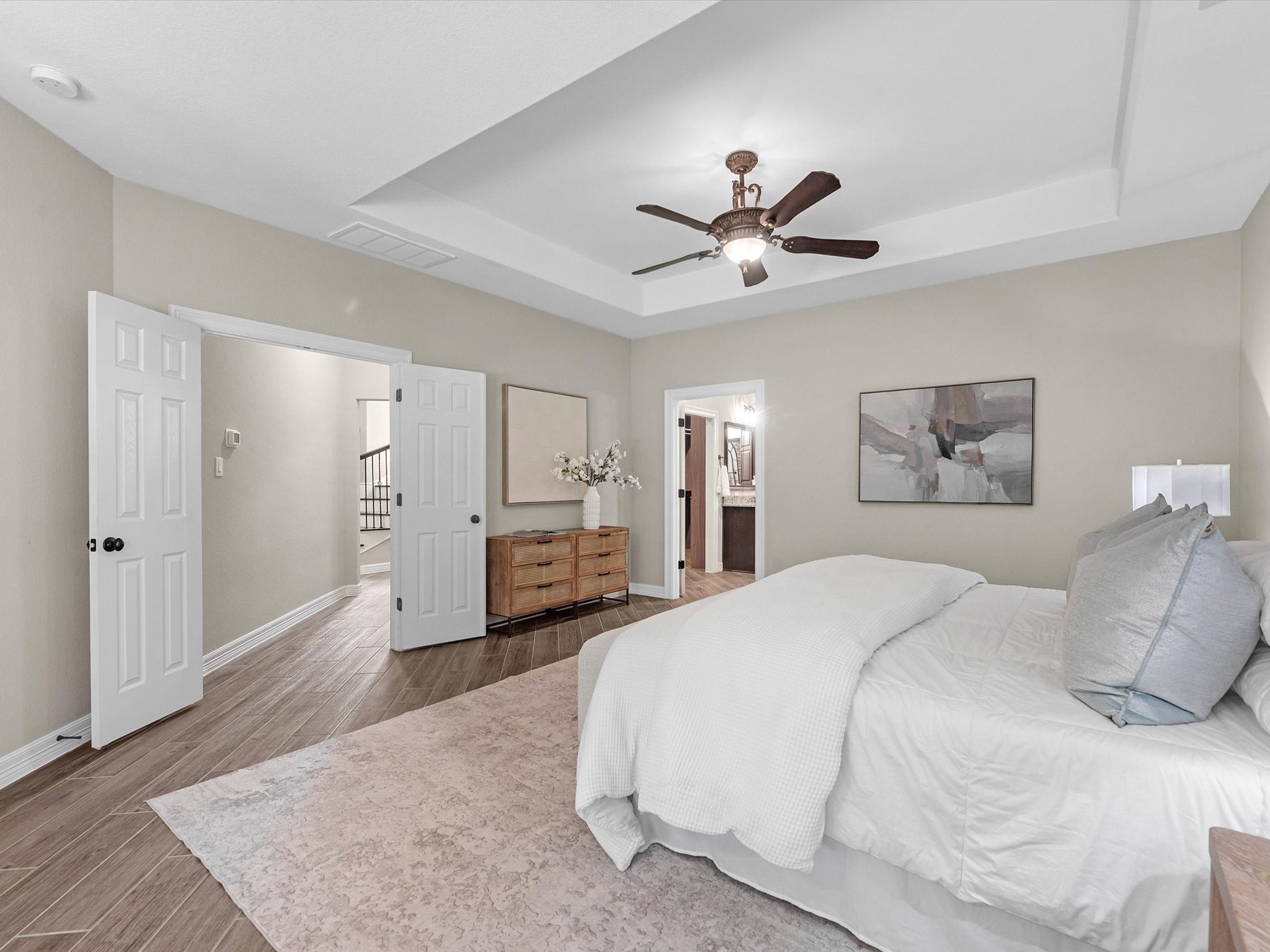 19332 Chateau Ridge Court Tomball, TX 77377 - Photo 22 of 50 a spacious bedroom with a bed and a chandelier