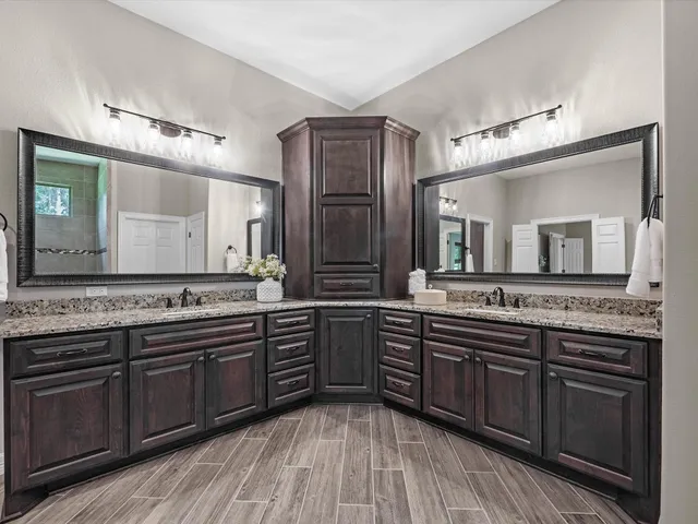 a large kitchen with cabinets and stainless steel appliances