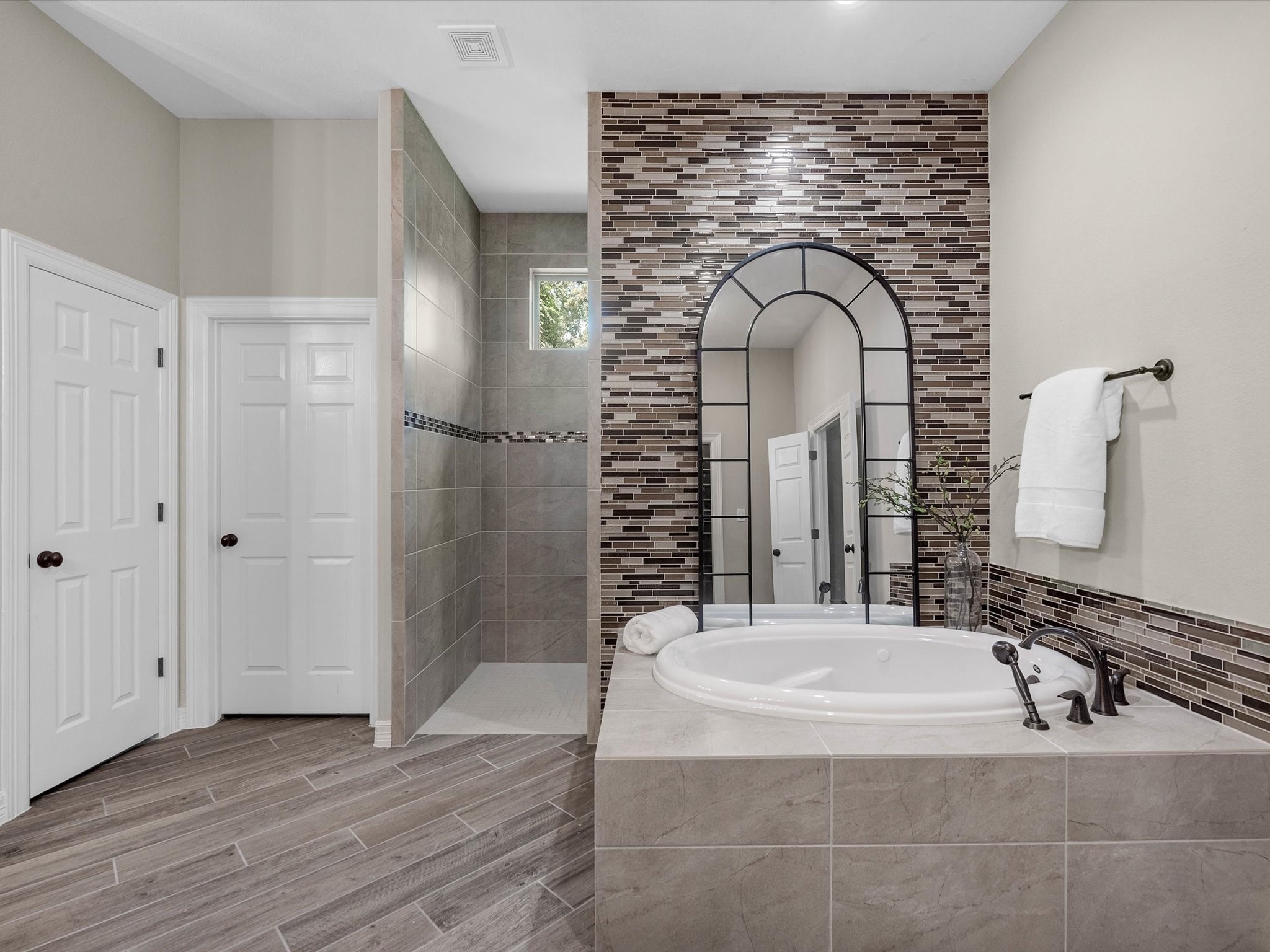 19332 Chateau Ridge Court Tomball, TX 77377 - Photo 26 of 50 a bathroom with a sink and a mirror