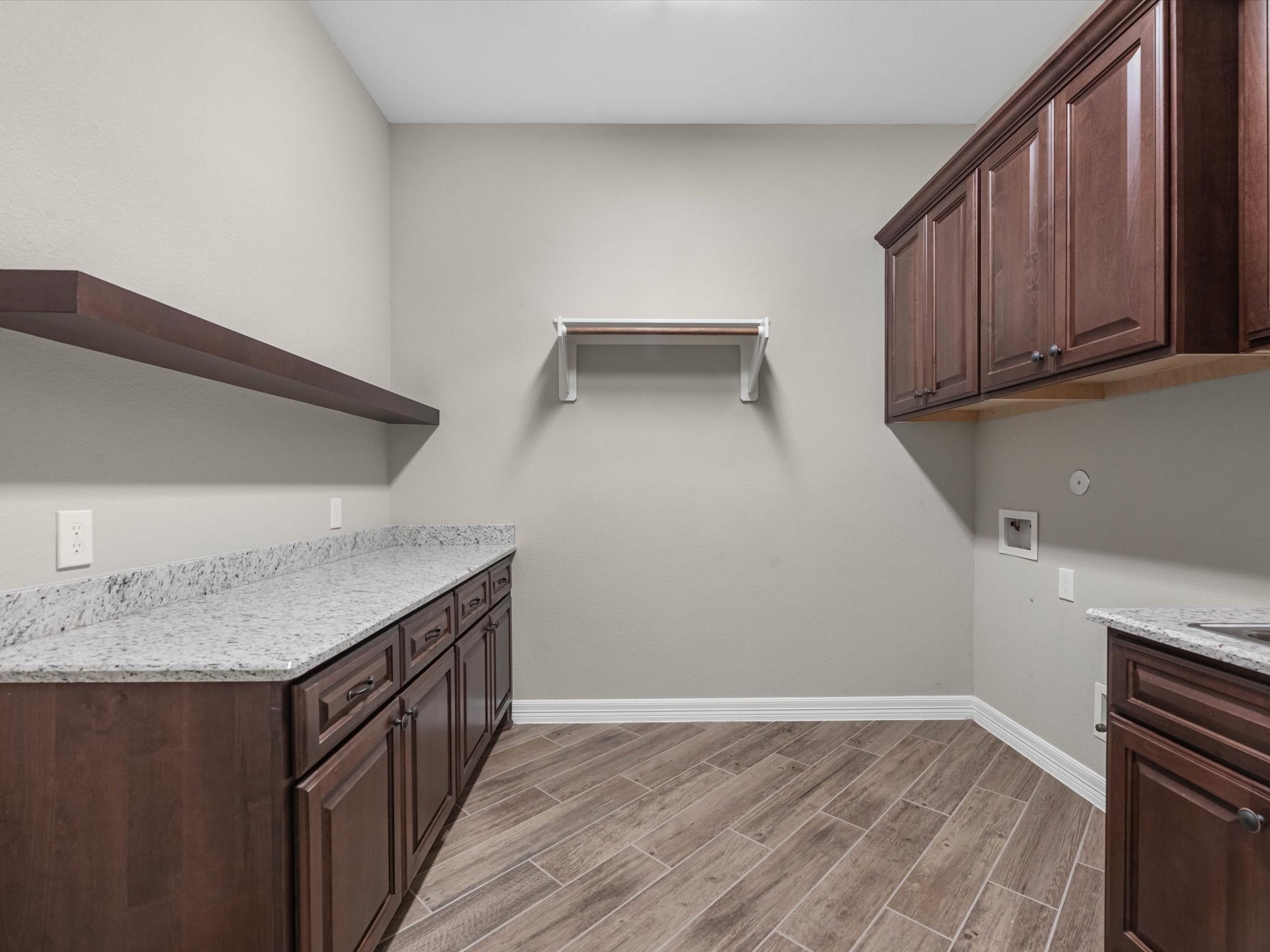 19332 Chateau Ridge Court Tomball, TX 77377 - Photo 32 of 50 a kitchen with granite countertop a sink and a stove