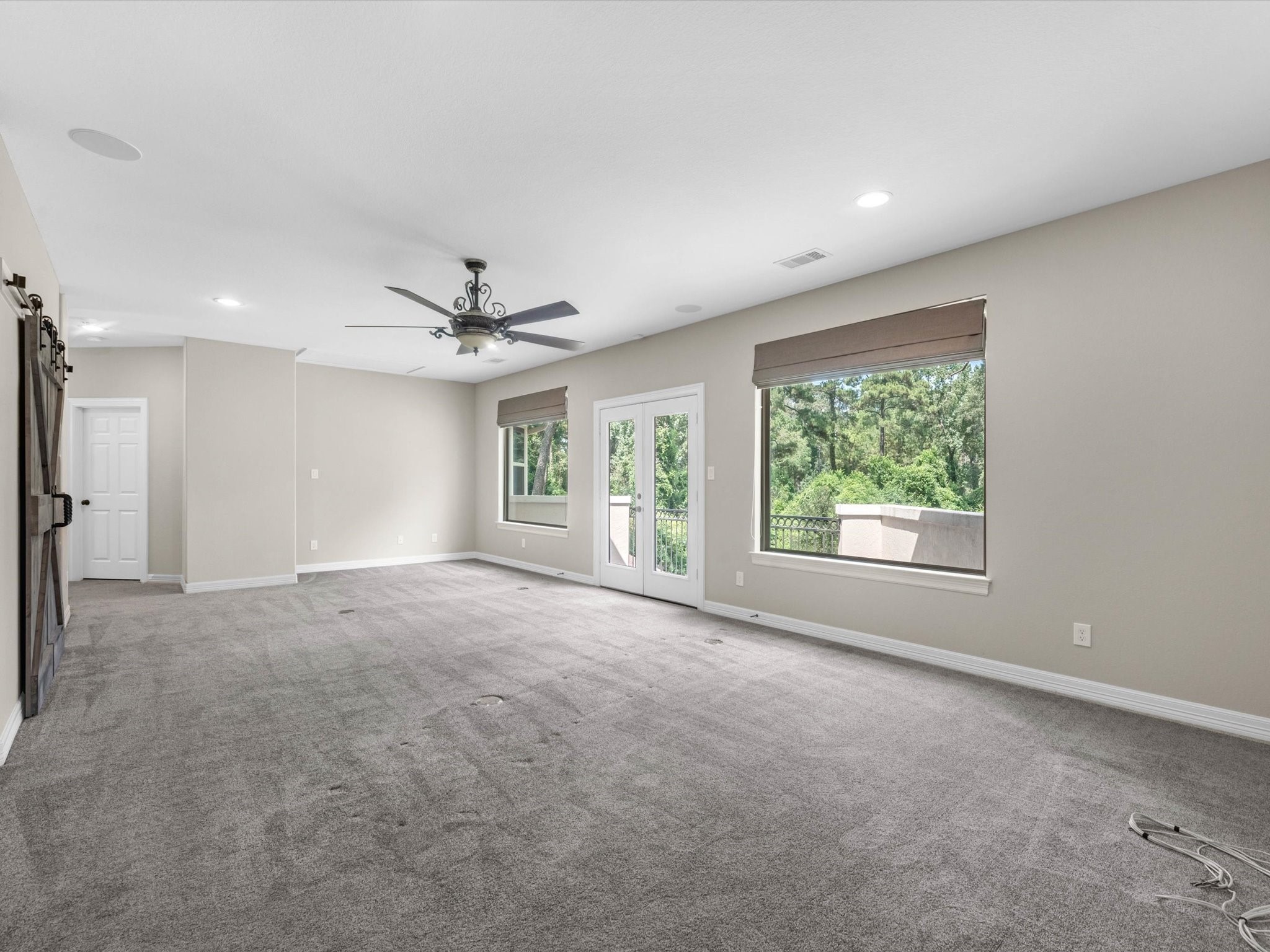 19332 Chateau Ridge Court Tomball, TX 77377 - Photo 36 of 50 a view of a livingroom with a ceiling fan and window