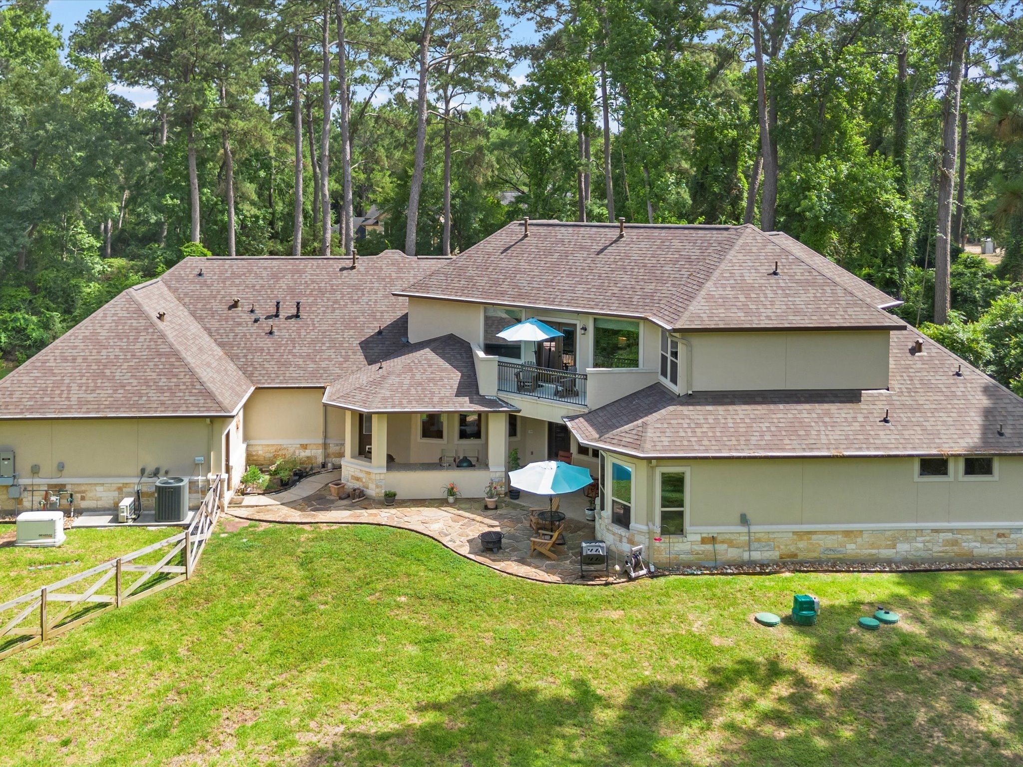 19332 Chateau Ridge Court Tomball, TX 77377 - Photo 42 of 50 a front view of a house with garden