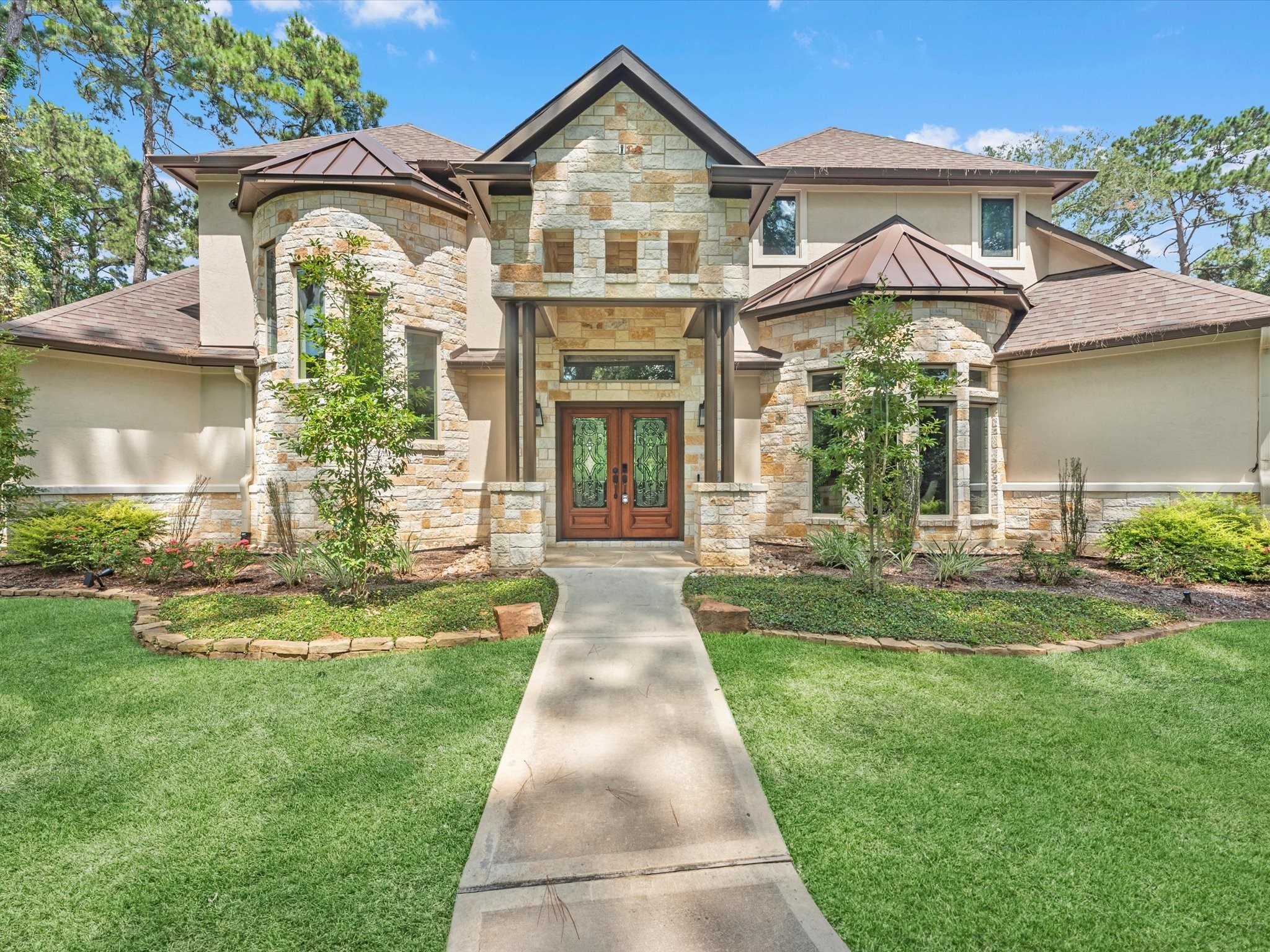 19332 Chateau Ridge Court Tomball, TX 77377 - Photo 6 of 50 front view of a house with a yard
