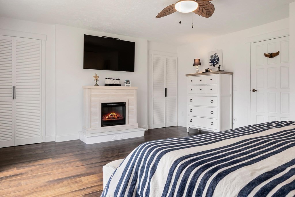 18 Durham Drive Lynnfield, MA 01940 - Photo 12 of 35 a bedroom with a bed and a flat screen tv