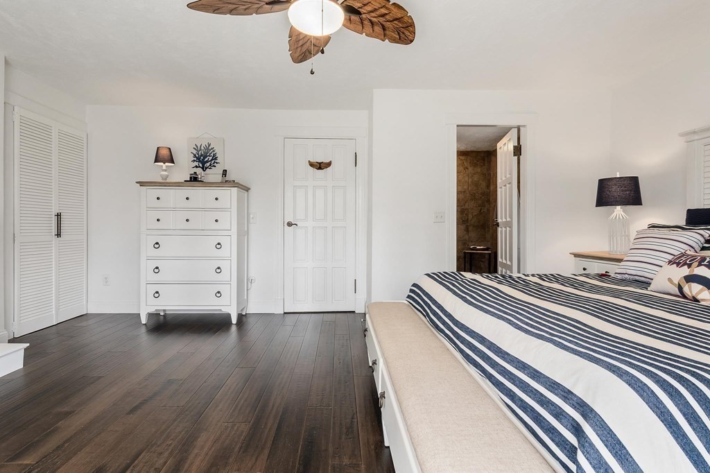 18 Durham Drive Lynnfield, MA 01940 - Photo 13 of 35 a bedroom with a bed and wooden floor