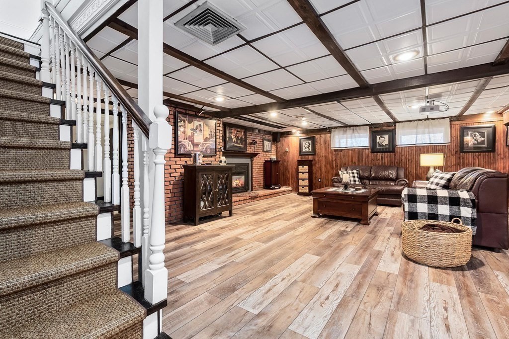 18 Durham Drive Lynnfield, MA 01940 - Photo 19 of 35 a living room with lots of furniture and a wooden floor