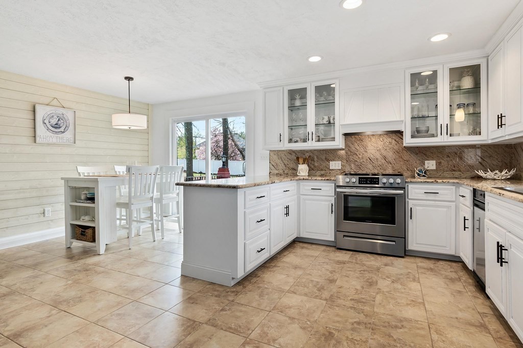 18 Durham Drive Lynnfield, MA 01940 - Photo 2 of 35 a kitchen with stainless steel appliances a stove sink and cabinets