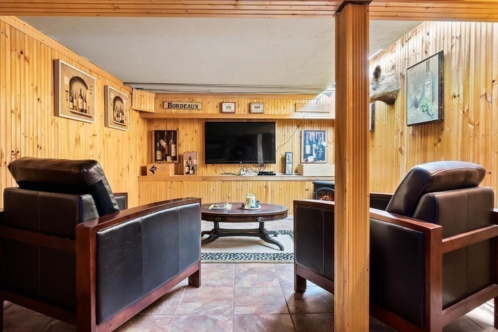 18 Durham Drive Lynnfield, MA 01940 - Photo 26 of 35 a living room with furniture and a flat screen tv