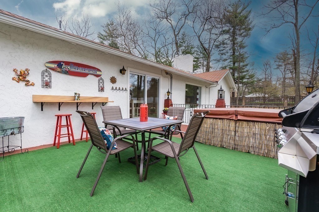 18 Durham Drive Lynnfield, MA 01940 - Photo 27 of 35 a view of a house with backyard and furniture