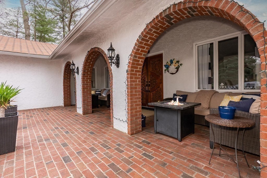 18 Durham Drive Lynnfield, MA 01940 - Photo 31 of 35 a view of living room and patio with a table
