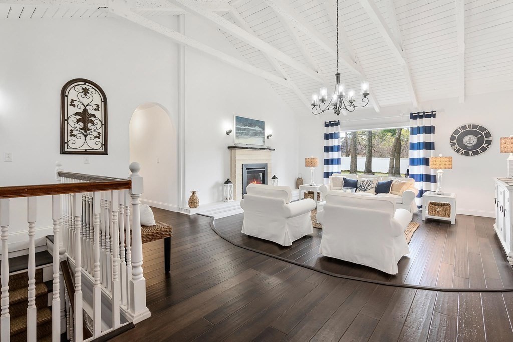 18 Durham Drive Lynnfield, MA 01940 - Photo 6 of 35 a living room with furniture and a chandelier