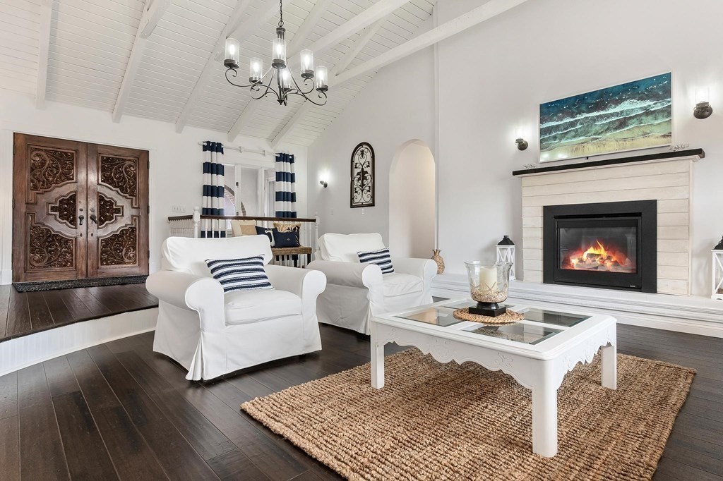 18 Durham Drive Lynnfield, MA 01940 - Photo 7 of 35 a living room with furniture a chandelier and a fireplace