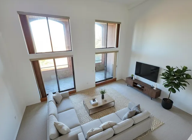 a bedroom with a bed and a night stand