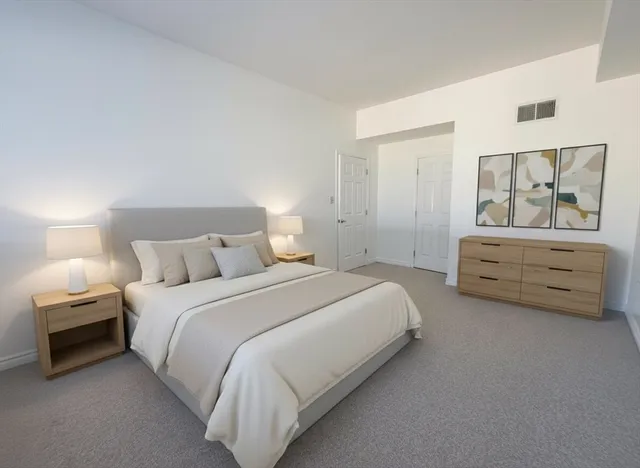 a view of a storage and utility room with refrigerator