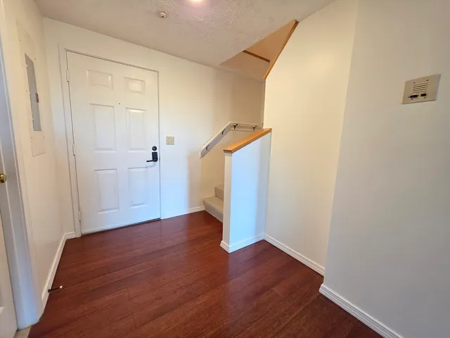 a view of an empty room with stairs