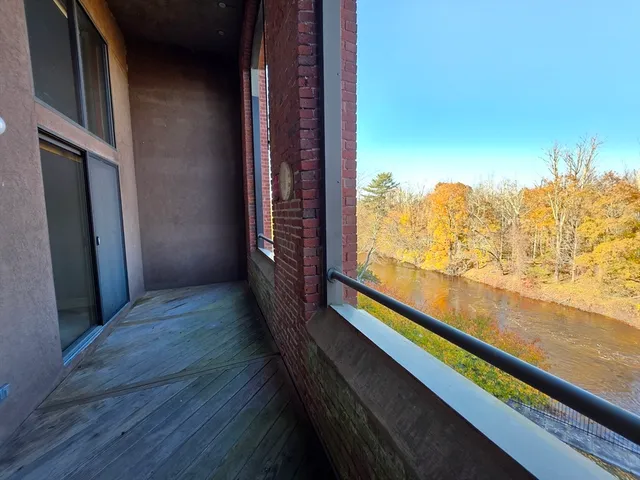 a lobby with furniture and potted plant