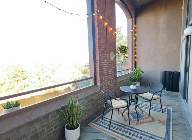 a view of hallway with a bathroom