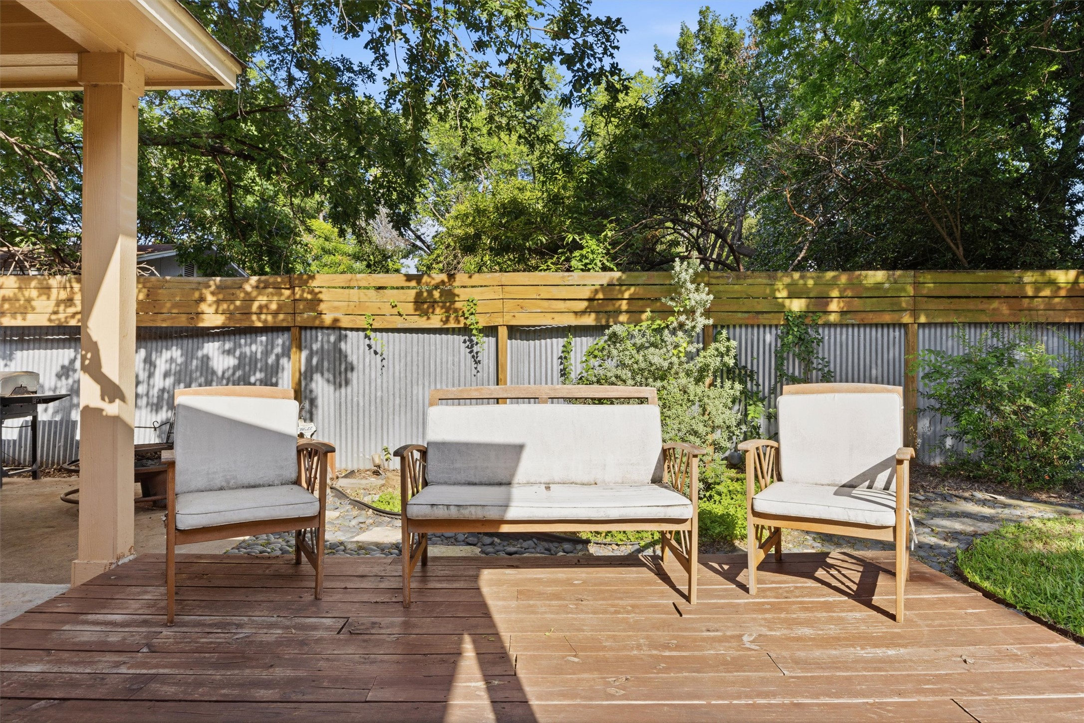 3015 Castro Street Austin, TX 78702 - Photo 33 of 40 A private deck with ample seating awaits, offering serene views of lush foliage.