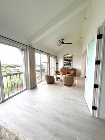 a large bedroom with a large bed and a large window