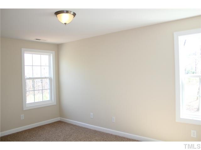 2804 Bending Tree Court Raleigh, NC 27613 - Photo 18 of 25 an empty room with windows