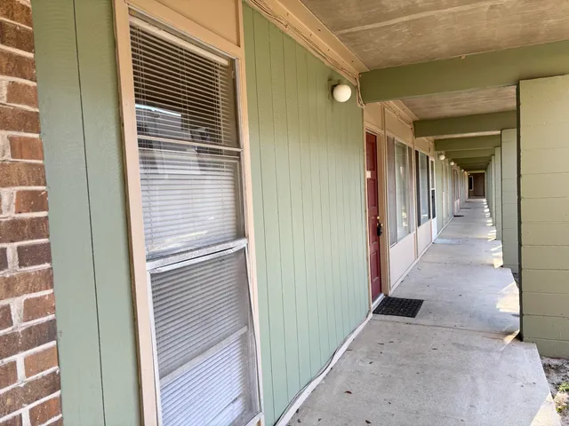 a view of a hallway with a white door
