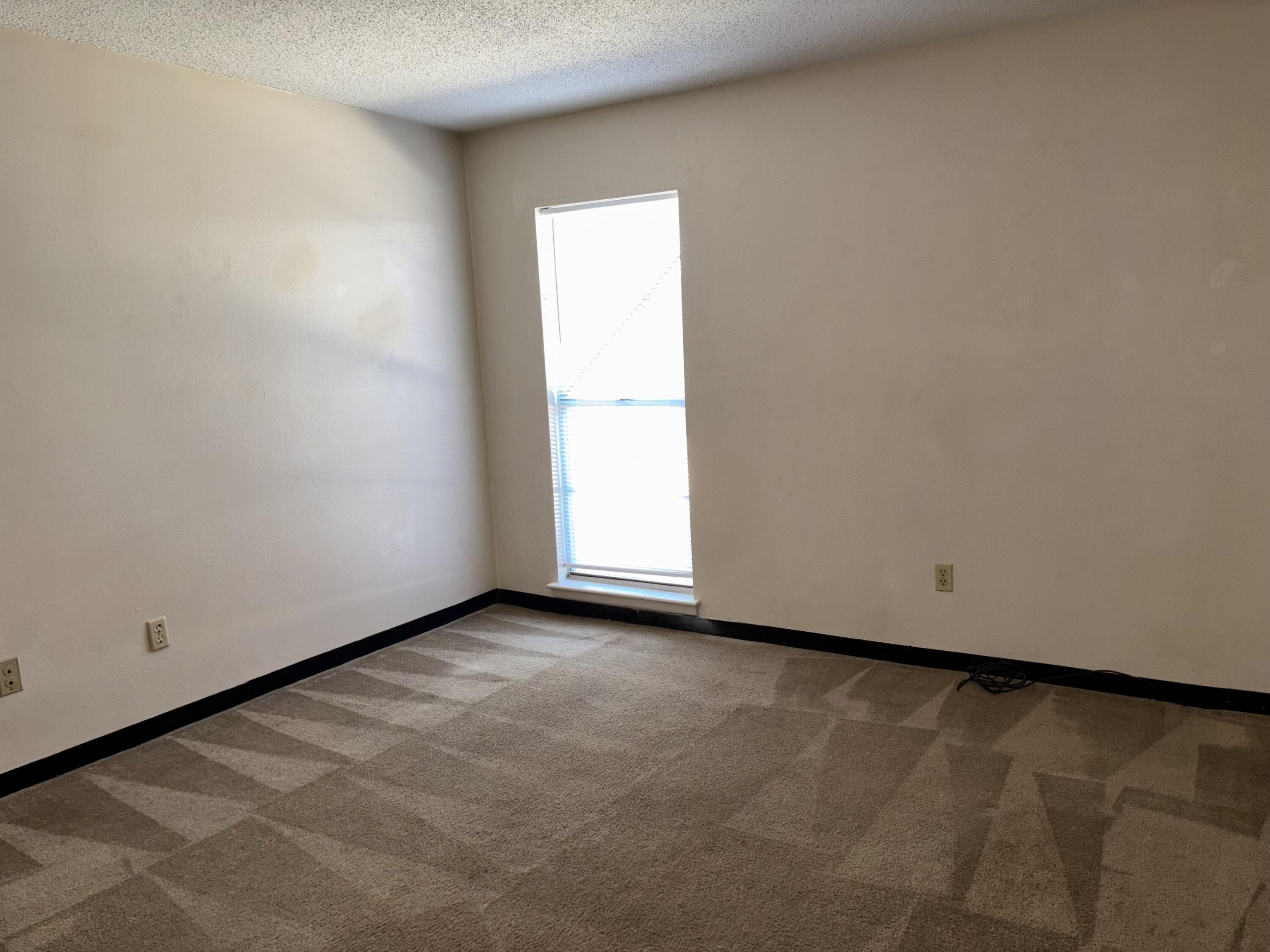210 Pelham Road, Unit 101B Fort Walton Beach, FL 32547 - Photo 8 of 10 a view of an empty room with a window
