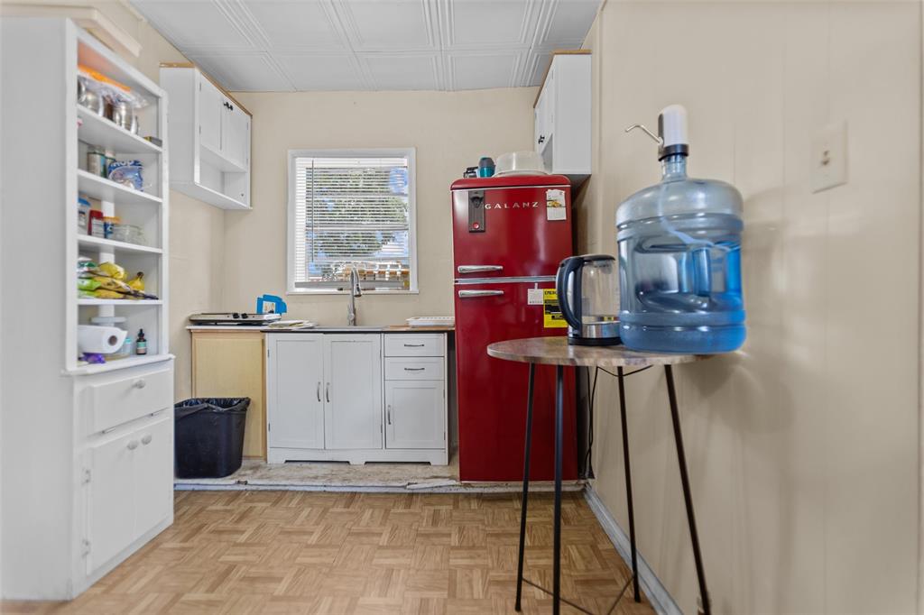 606 North Needmore Street Athens, TX 75751 - Photo 11 of 17 a kitchen with a sink cabinets and window