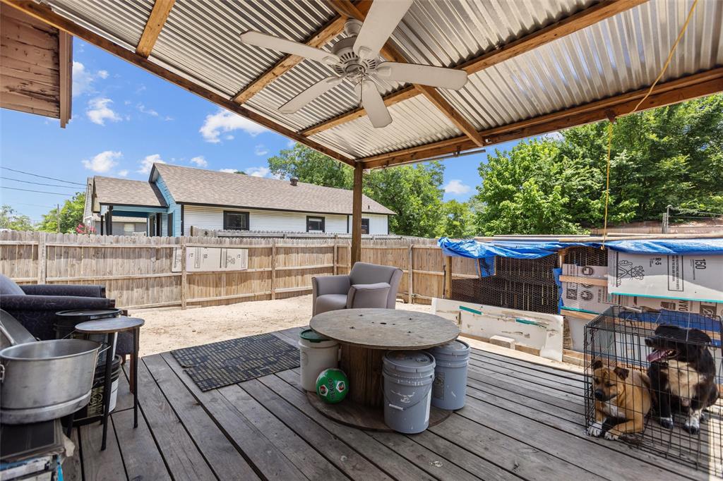 606 North Needmore Street Athens, TX 75751 - Photo 13 of 17 a view of a patio with table and chairs barbeque with wooden floor and fence
