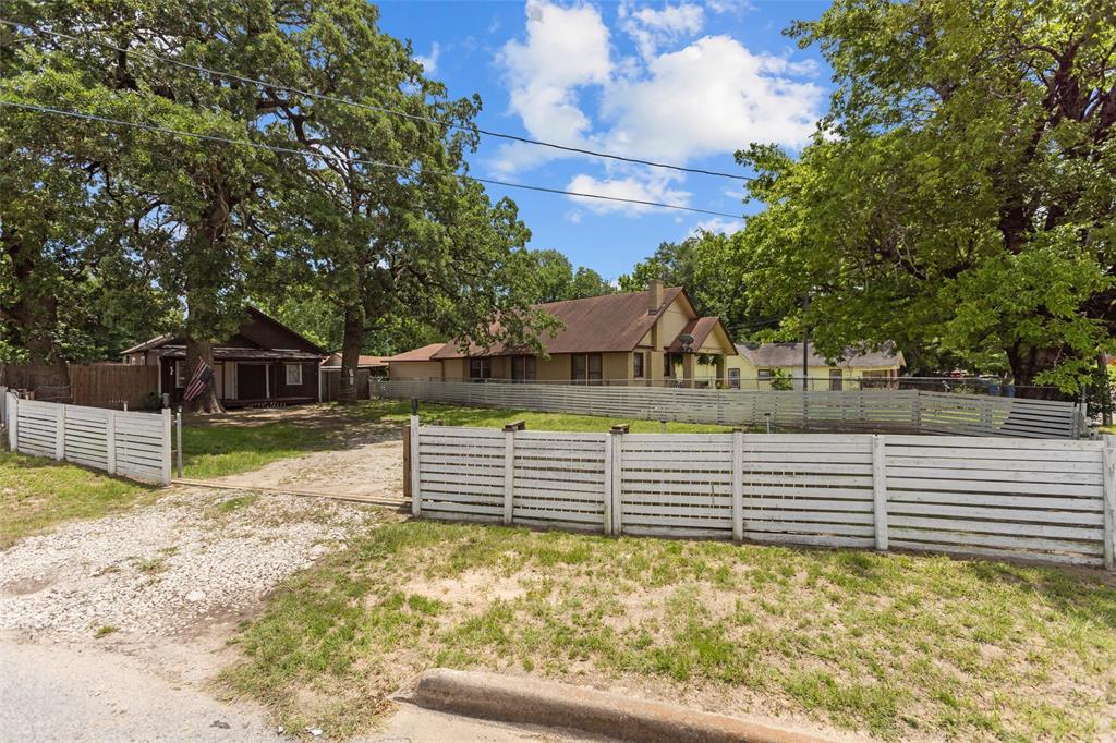 606 North Needmore Street Athens, TX 75751 - Photo 16 of 17 a view of a yard with wooden fence