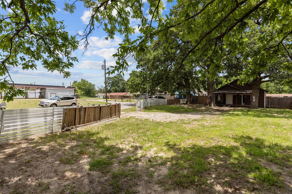 606 North Needmore Street Athens, TX 75751 - Photo 17 of 17 a swimming pool with outdoor seating and yard