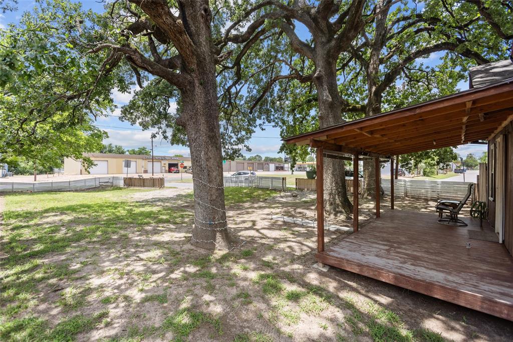 606 North Needmore Street Athens, TX 75751 - Photo 3 of 17 a backyard of a house with table and chairs