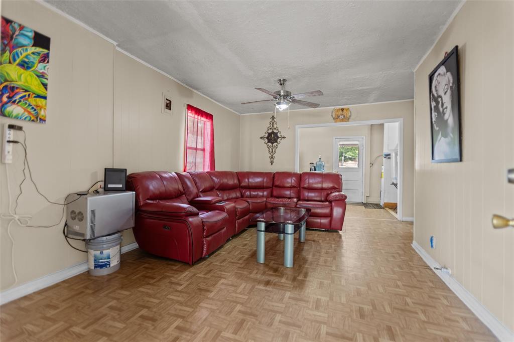 606 North Needmore Street Athens, TX 75751 - Photo 6 of 17 a living room with furniture and a chandelier