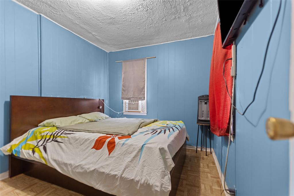 606 North Needmore Street Athens, TX 75751 - Photo 10 of 17 a bed sitting in a bedroom next to a window