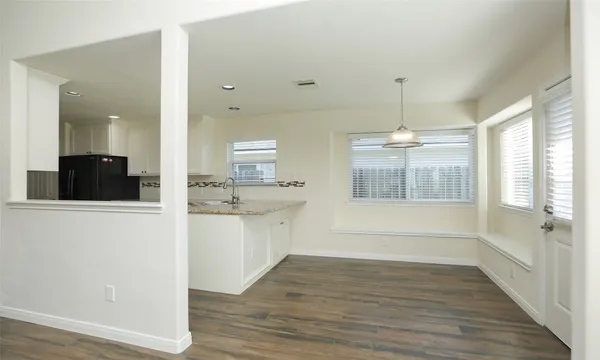 a bathroom with a sink shower and a mirror