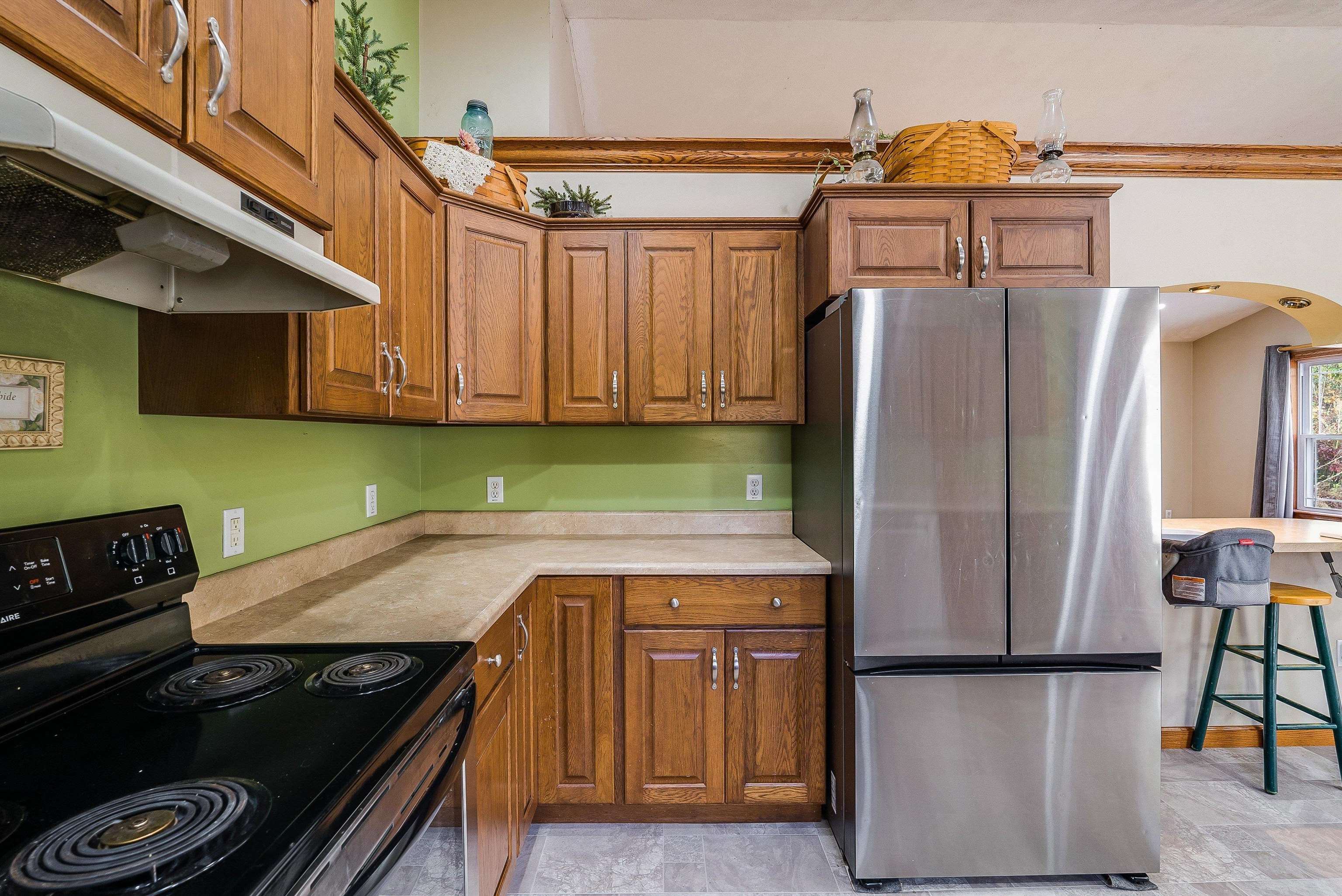 8499 Copperhead Road Singers Glen, VA 22850 - Photo 19 of 75 a kitchen with stainless steel appliances granite countertop a stove and a refrigerator