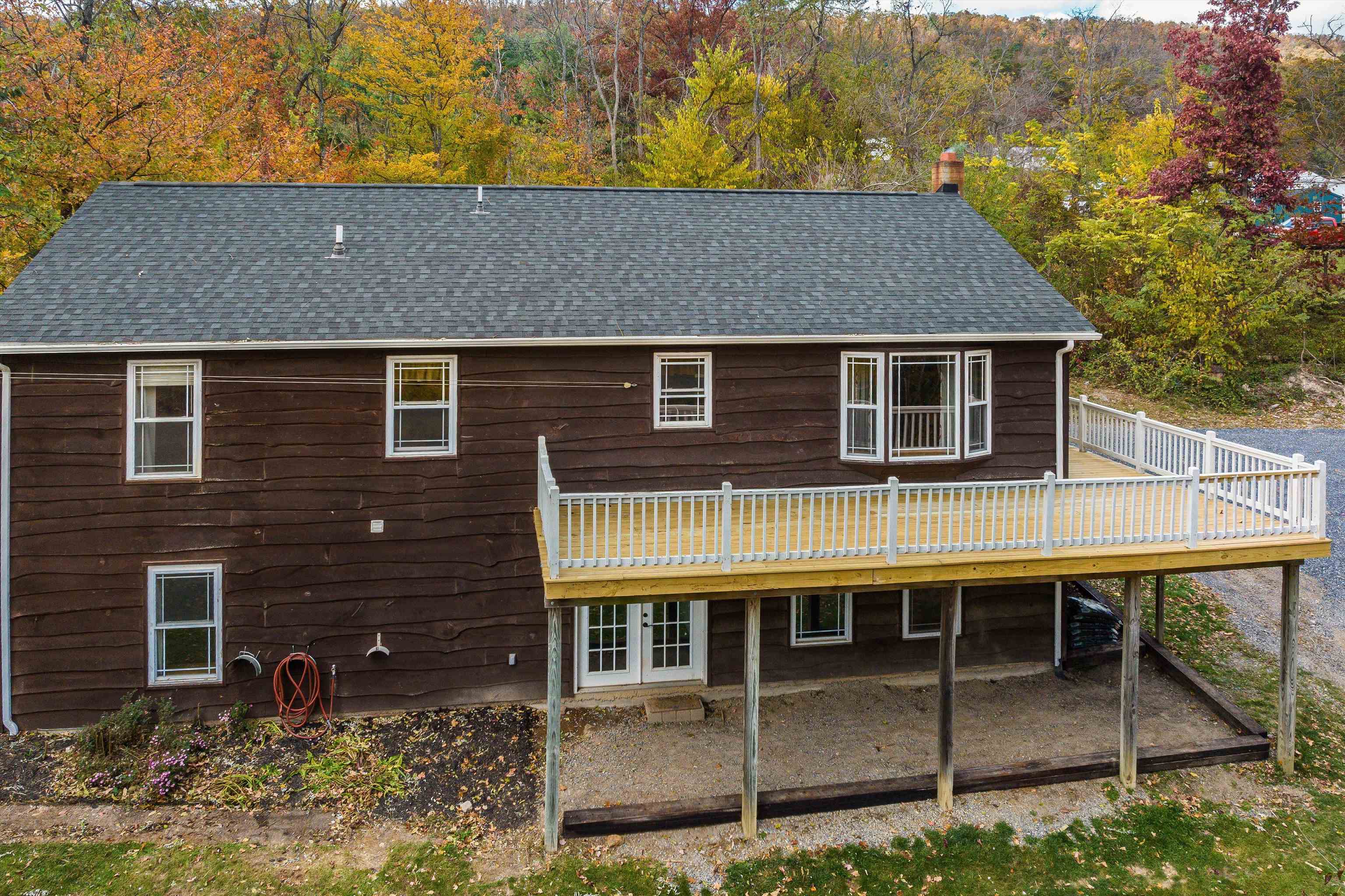 8499 Copperhead Road Singers Glen, VA 22850 - Photo 2 of 75 a aerial view of a house with a yard and balcony