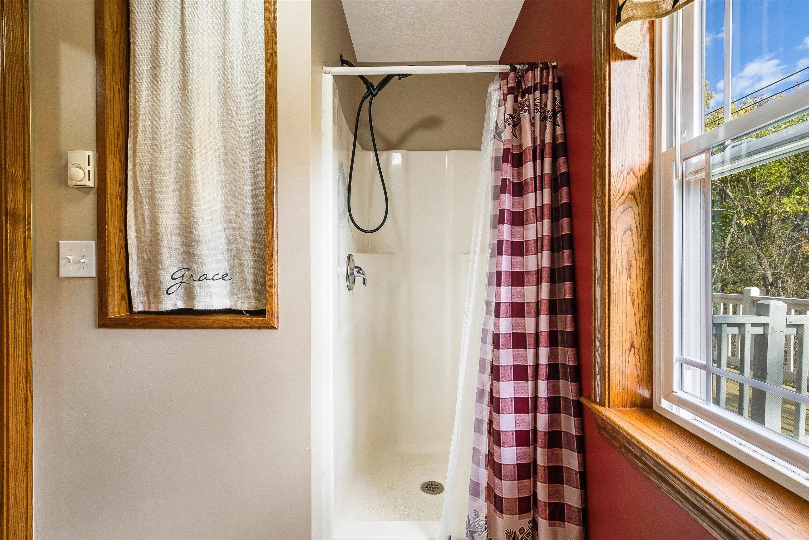 8499 Copperhead Road Singers Glen, VA 22850 - Photo 34 of 75 a view of a bathroom with a shower and a window