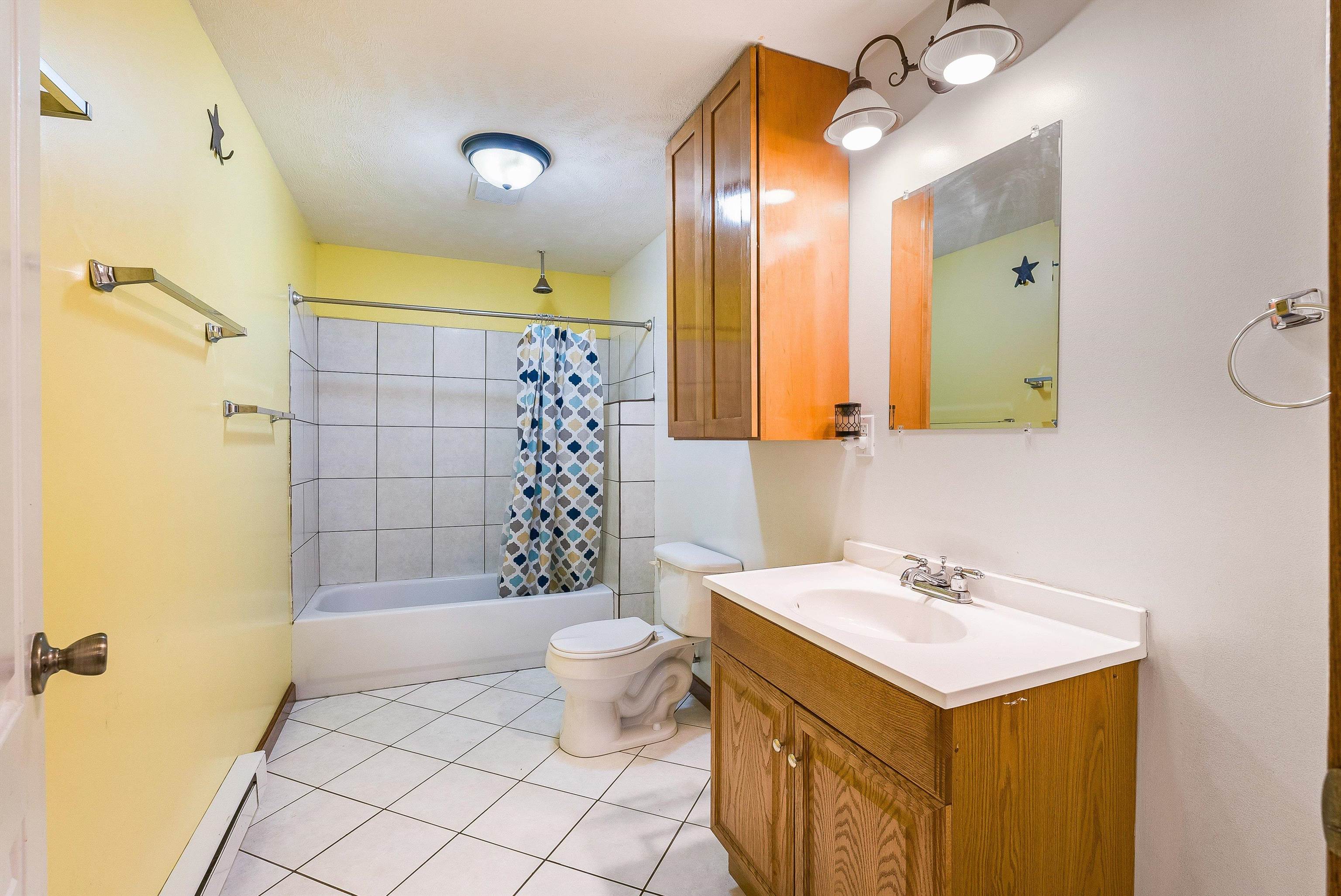 8499 Copperhead Road Singers Glen, VA 22850 - Photo 42 of 75 a bathroom with a sink mirror vanity and toilet