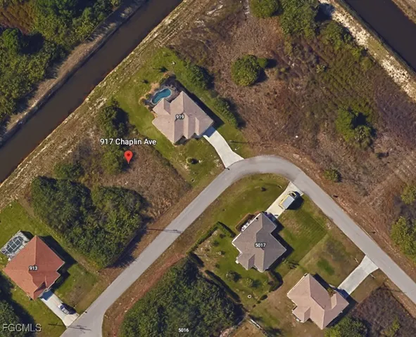 an aerial view of a house with outdoor space