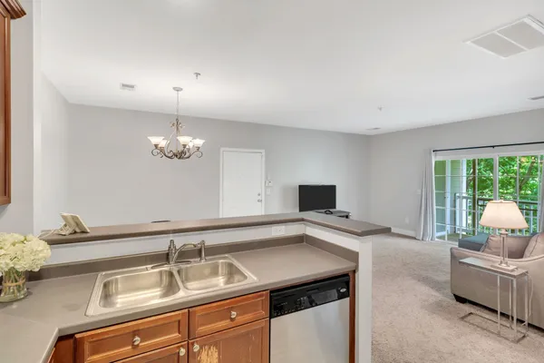 a kitchen with a sink and a window