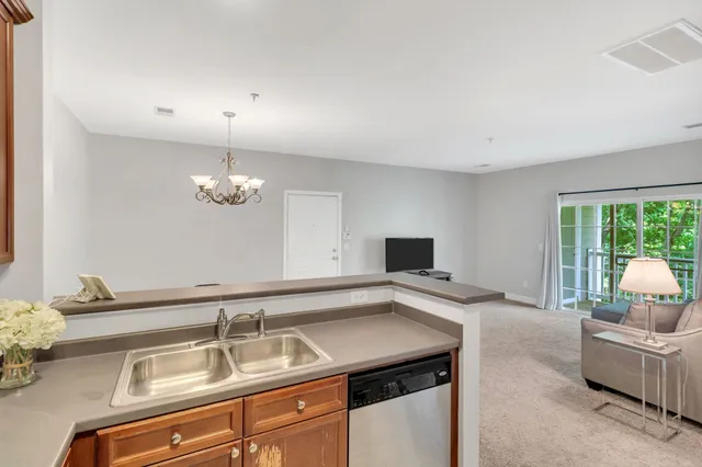 a kitchen with a sink and a window