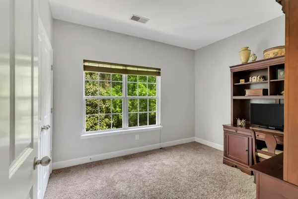 a view of room with workspace and a window