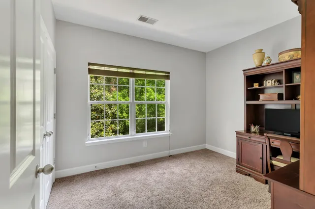 a view of room with workspace and a window